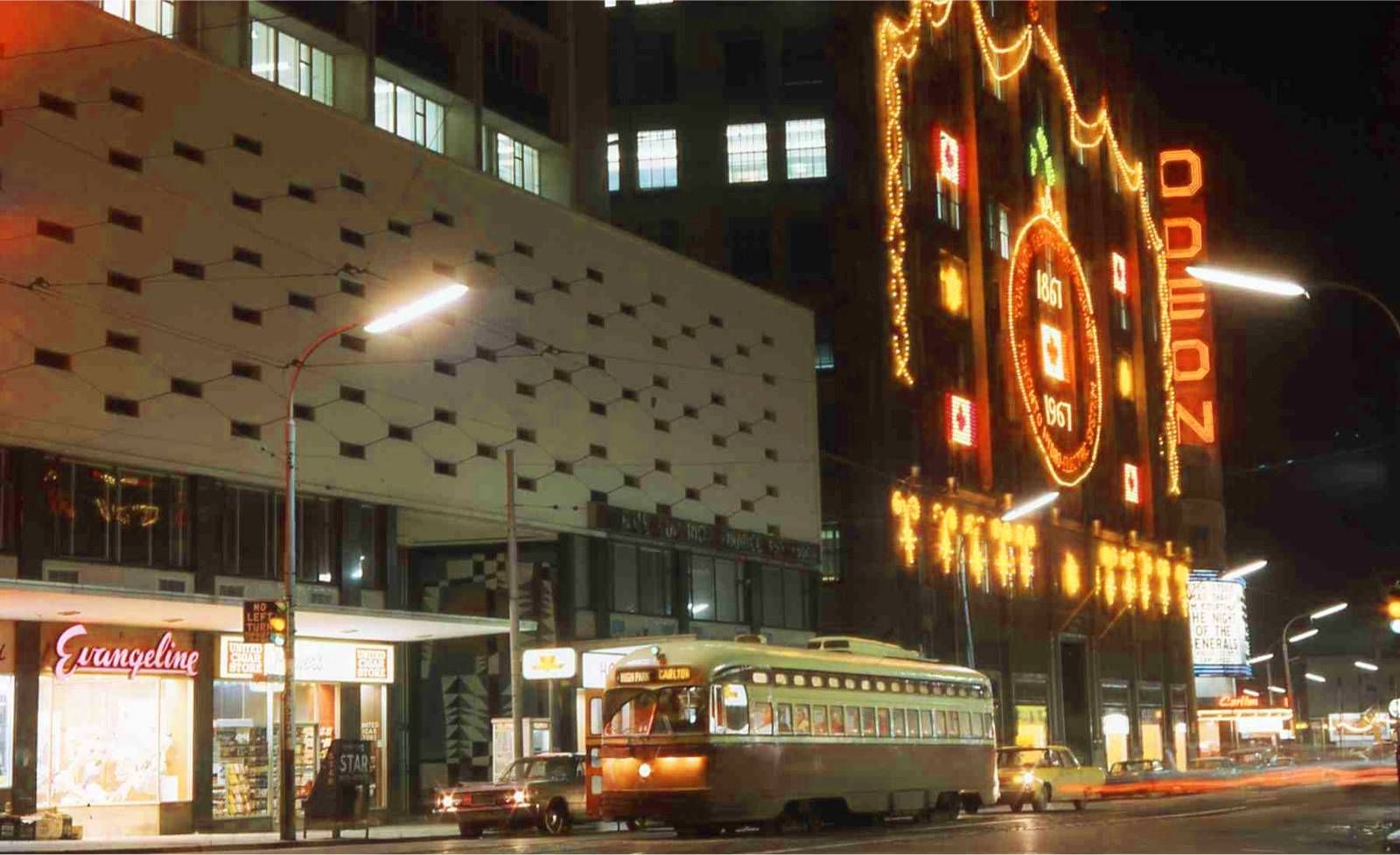 PHOTO-TORONTO-CARLTON-JUSTEOFYONGE-NIGHT-HYDROBUILDING-EVANGELINE-UNITEDCIGAR-ODEON-STREETCAR-1967.jpg