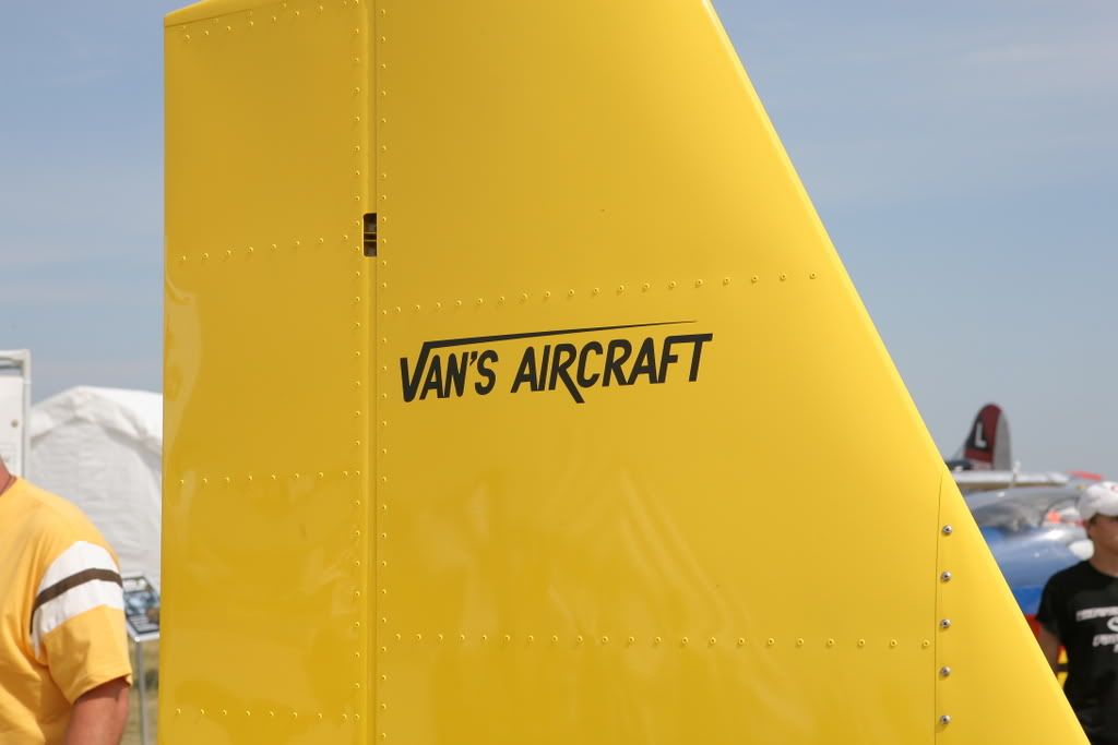 Van's Aircraft logo in yellow and black on the tail of a Van's plane Van's Aircraft logo in yellow and black on the tail of a Van's plane