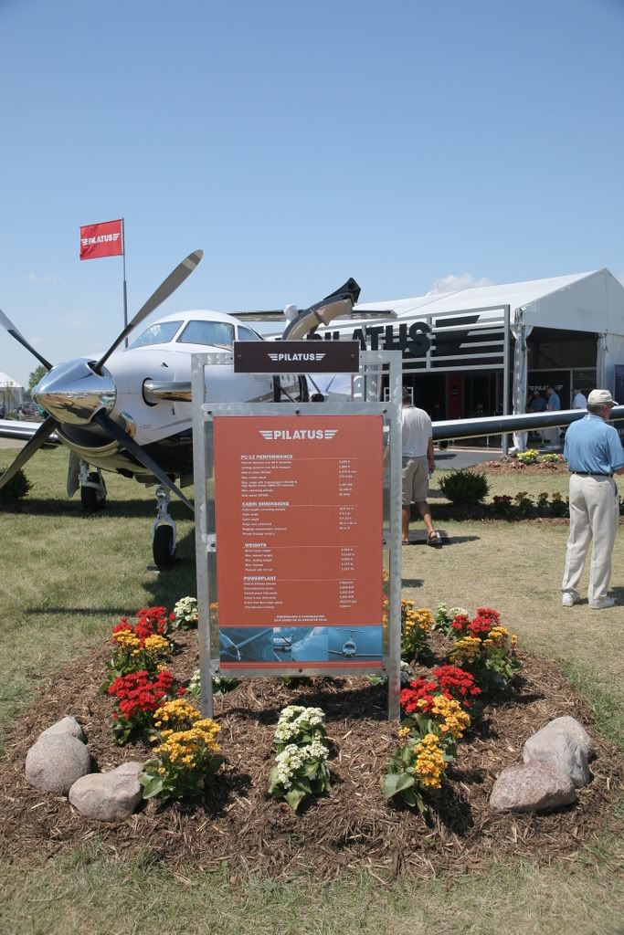 Pilatus PC-12 parked next to statistics board